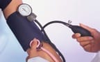 taking blood pressure manually with proper arm position